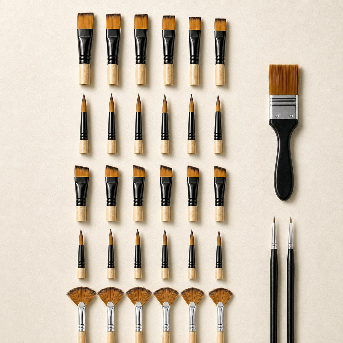 Close view of all thirty-three brush heads on warm ivory, arranged in rows by shape: flat, round, angled, filbert and fan, with the wide flat brush and two liners alongside.