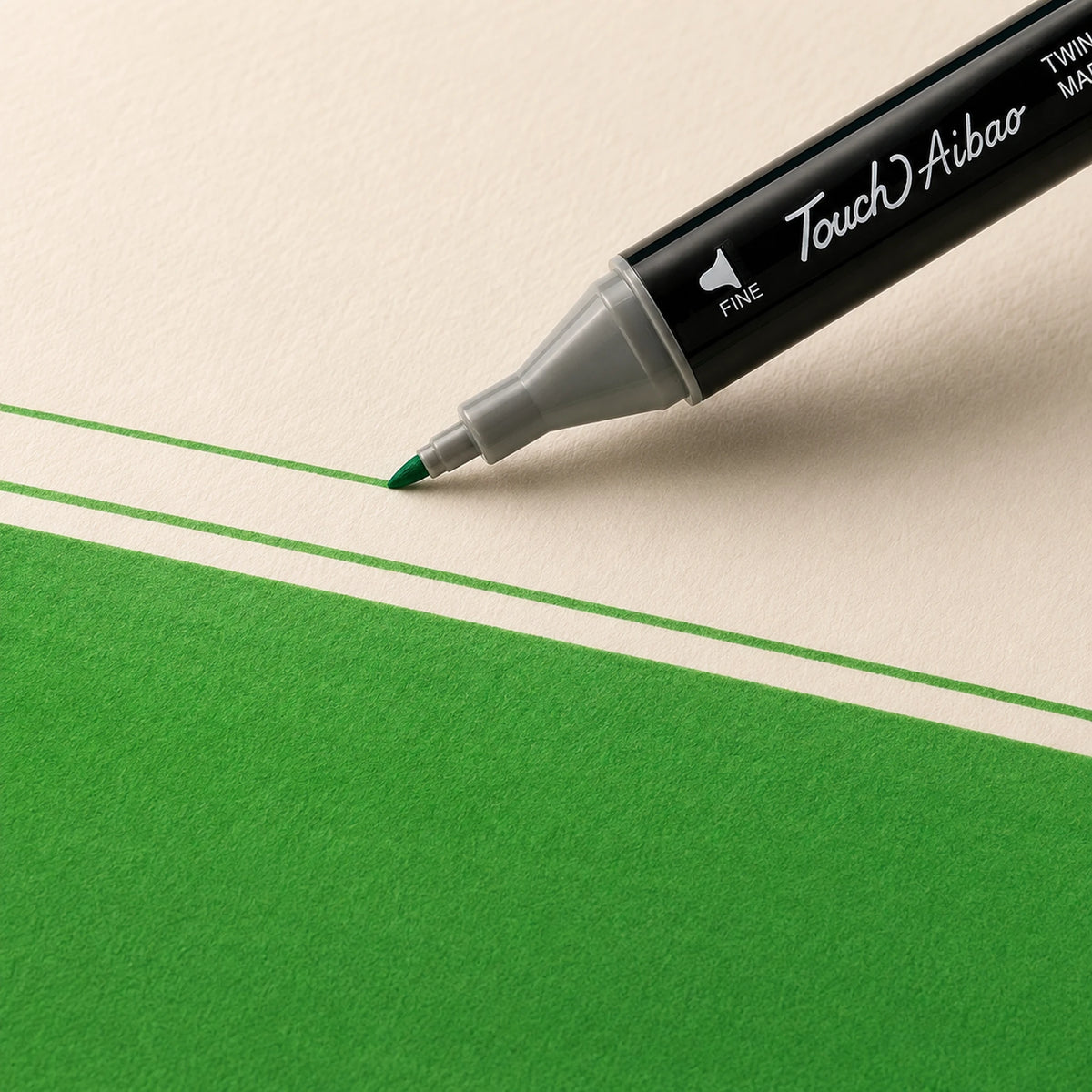 Fine bullet nib of a Touch Aibao marker drawing a crisp thin 46 Vivid Green line on ivory art paper