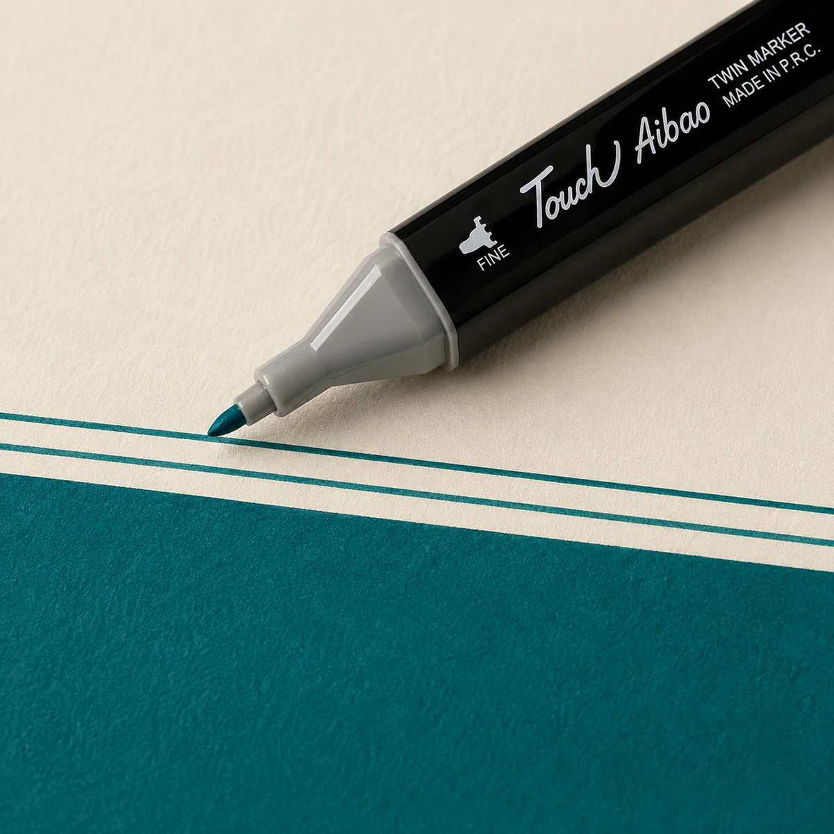 Fine bullet nib of a Touch Aibao marker drawing a crisp thin Peacock Green line on ivory art paper
