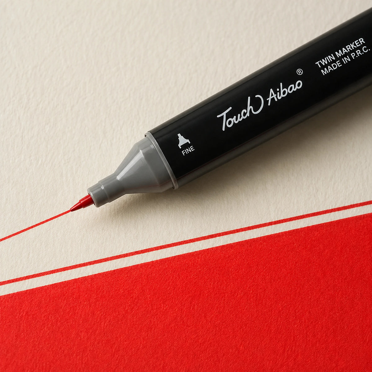 Fine bullet nib drawing a crisp thin Scarlet alcohol marker line on ivory art paper