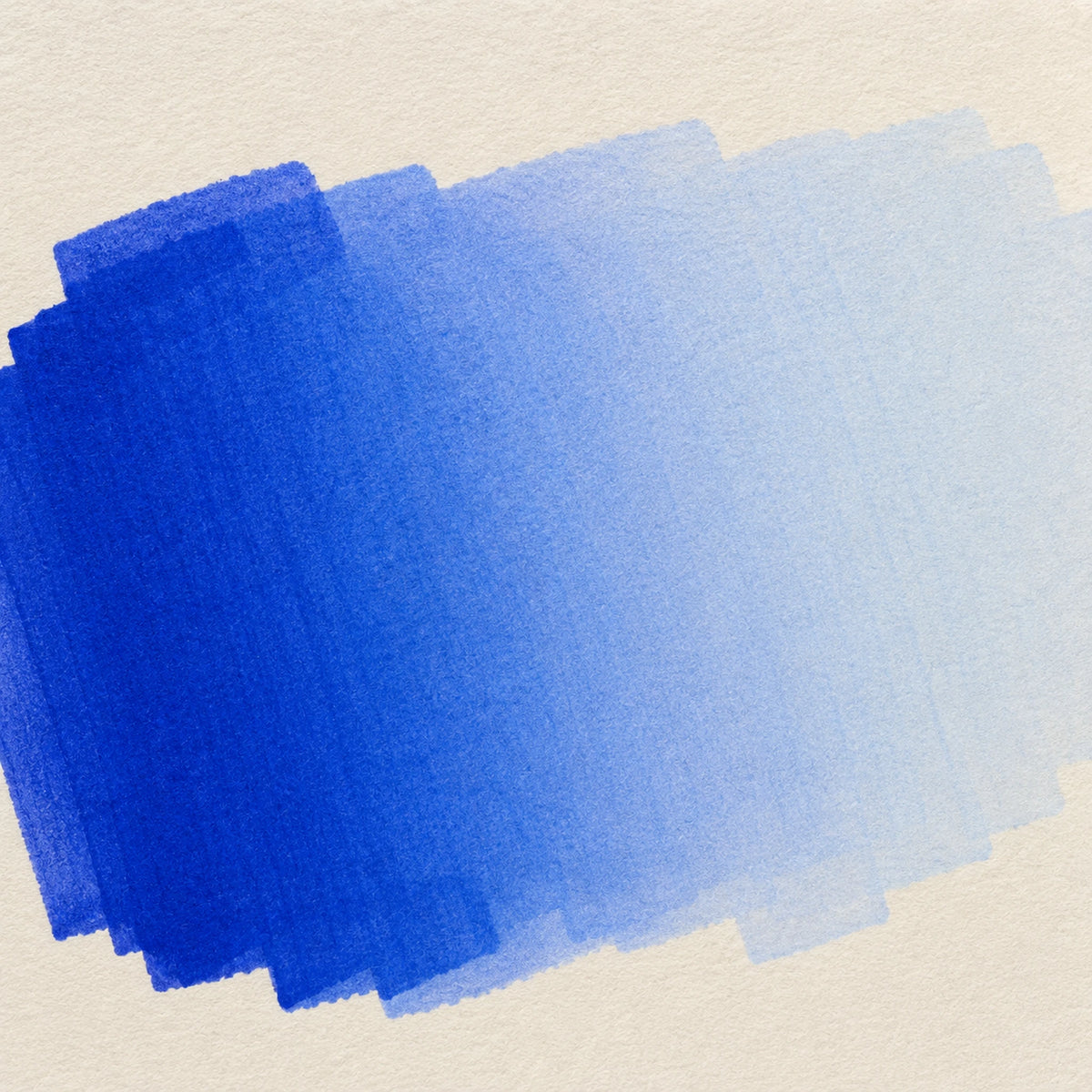 Close macro of alcohol ink blending from Cobalt Blue into Pastel Blue in one seamless band on ivory art paper