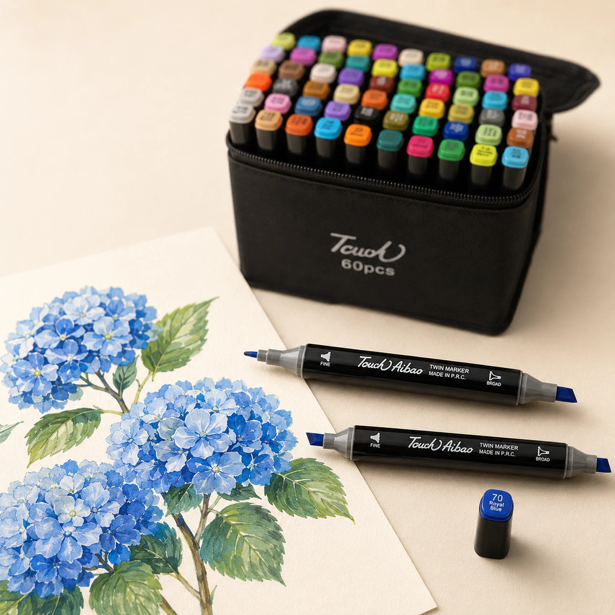 Blue hydrangea study beside the open TOUCH 60 alcohol marker set, two twin markers and a 70 Royal Blue cap