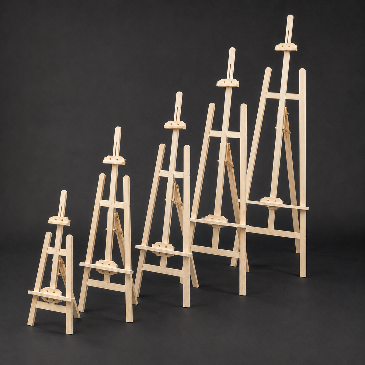 Beech wood easels from tabletop to full height, arranged by size