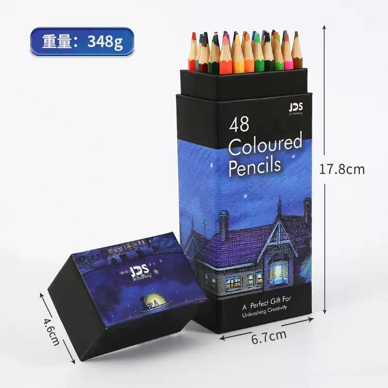 Open black JDS gift box printed 48 Coloured Pencils, night-scene artwork around the middle, pencils standing tips-up inside with bare timber barrels and coloured leads.