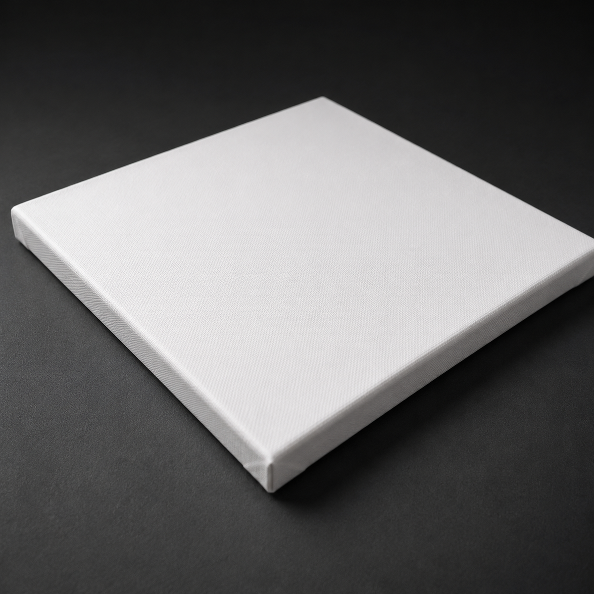 Stretched canvas laid flat showing the primed cotton weave